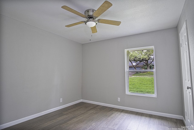 spare room with hardwood / wood-style flooring, a textured ceiling, and ceiling fan