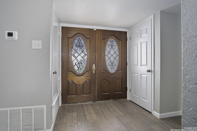 foyer featuring hardwood / wood-style flooring