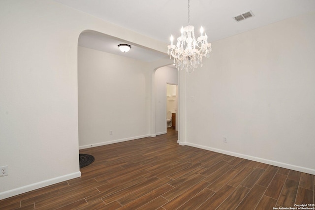 spare room featuring dark hardwood / wood-style flooring