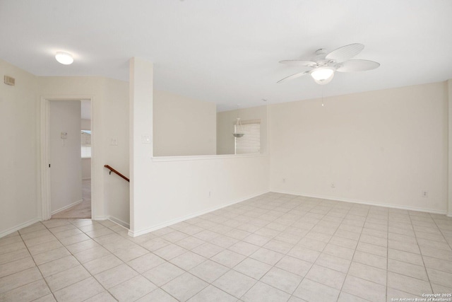 tiled empty room with ceiling fan