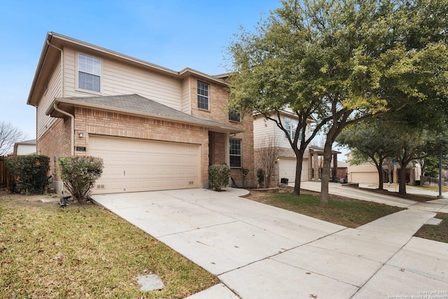 view of front facade with a garage and a front lawn