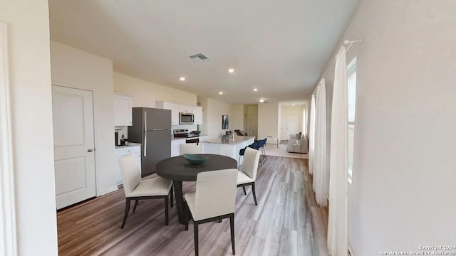 dining area featuring light hardwood / wood-style floors