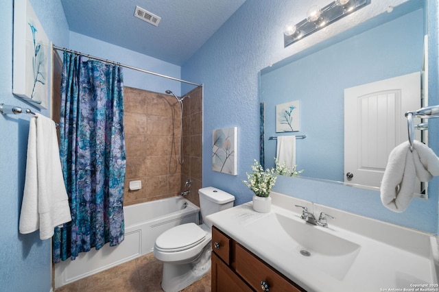 full bathroom featuring vanity, shower / tub combo, toilet, tile patterned floors, and a textured ceiling