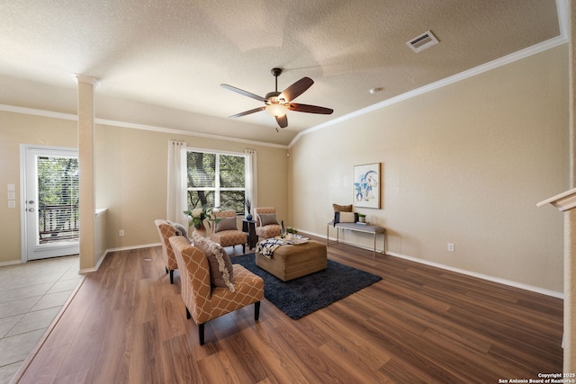 living room featuring hardwood / wood-style floors, a wealth of natural light, and ceiling fan