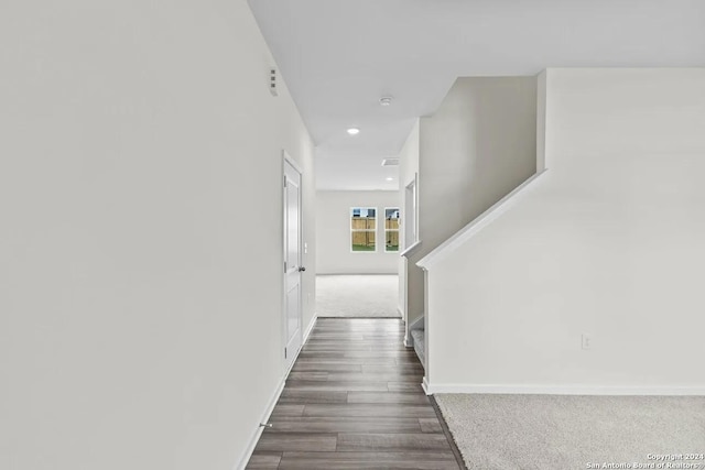 hall featuring dark wood-type flooring