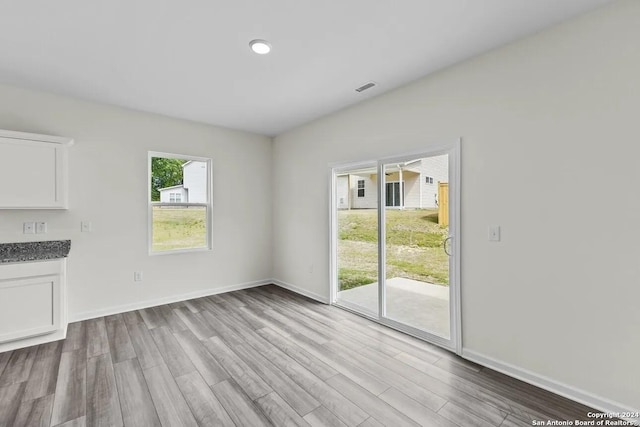 unfurnished living room featuring light wood-type flooring