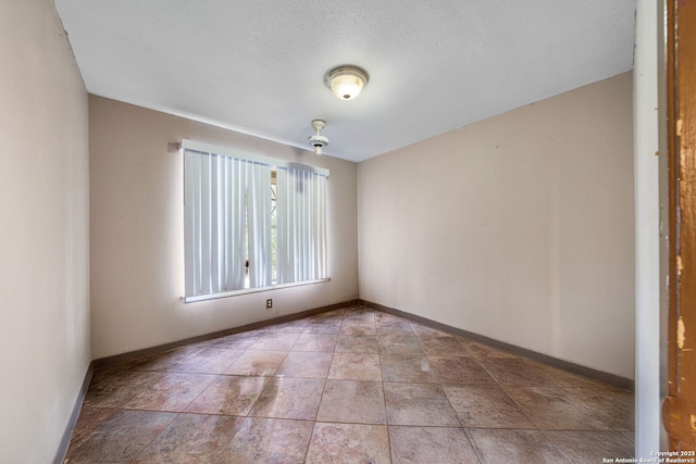 unfurnished room with tile patterned floors