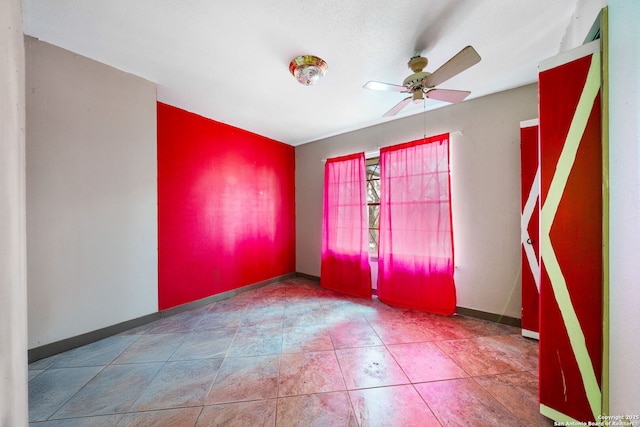 spare room featuring ceiling fan