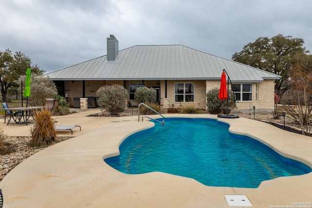 view of pool with a patio