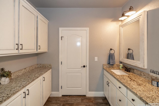 bathroom featuring hardwood / wood-style flooring and vanity