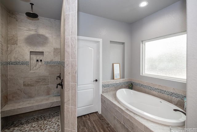 bathroom with wood-type flooring and separate shower and tub