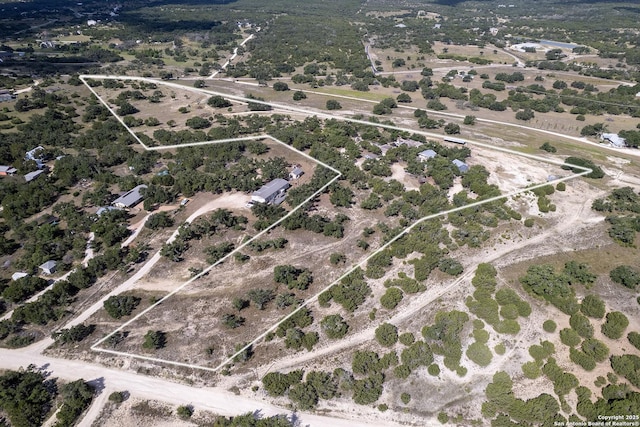 birds eye view of property featuring a rural view