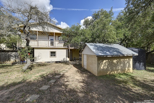back of property with a shed