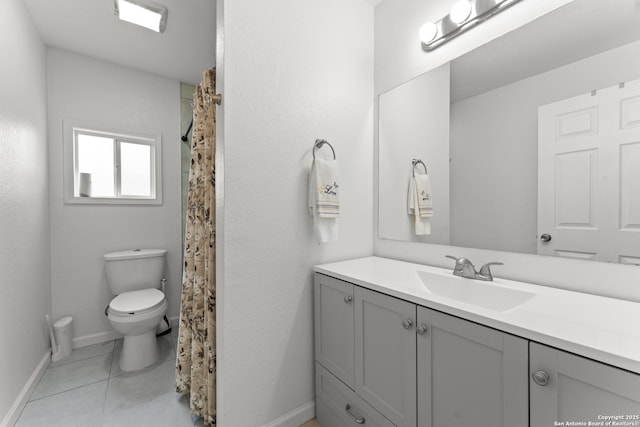 bathroom with vanity, tile patterned floors, and toilet