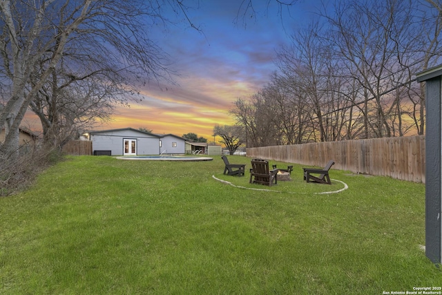 yard at dusk with a pool