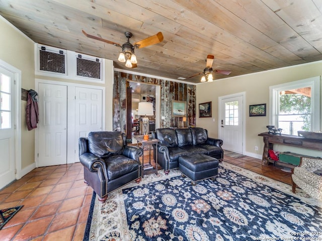 tiled living room with ceiling fan, a wealth of natural light, and wood ceiling