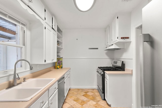 kitchen featuring white cabinetry, stainless steel appliances, and sink