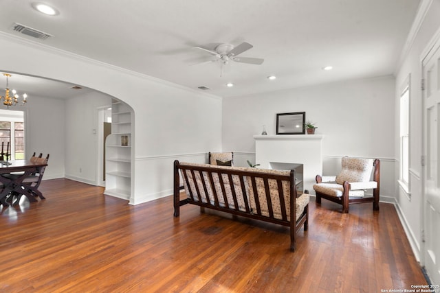 bedroom with crown molding, an inviting chandelier, and dark hardwood / wood-style flooring