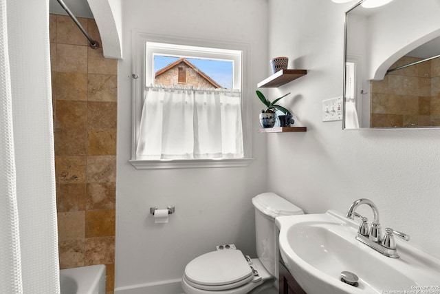 full bathroom with shower / bathtub combination with curtain, toilet, and sink