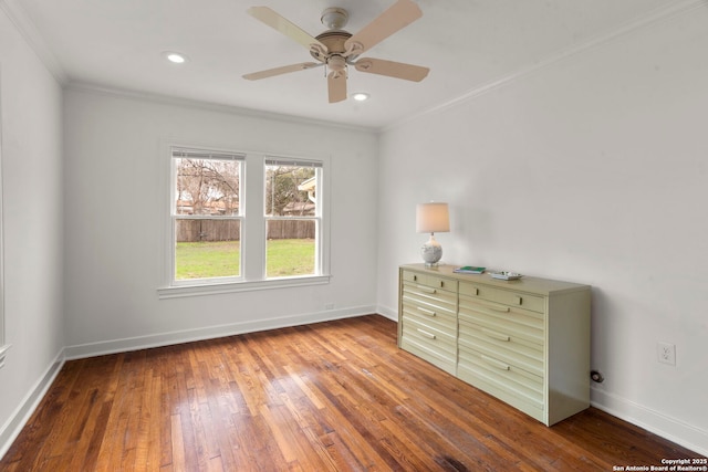 unfurnished bedroom with crown molding, wood-type flooring, and ceiling fan