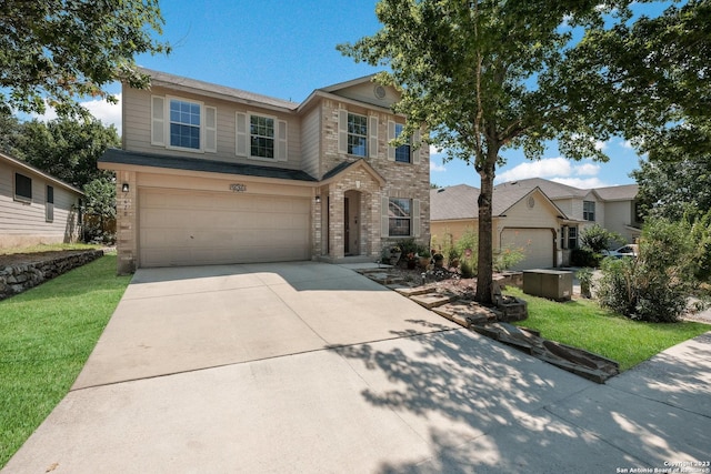 view of front of home featuring a garage and a front lawn