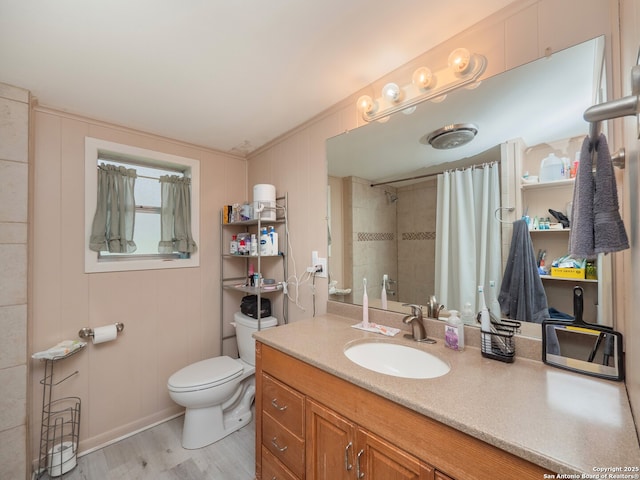 bathroom with vanity, curtained shower, wood-type flooring, and toilet