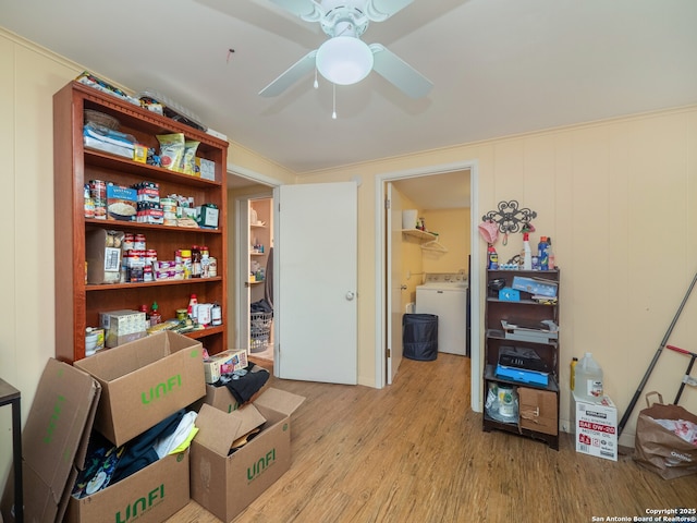 storage area with washer / clothes dryer and ceiling fan