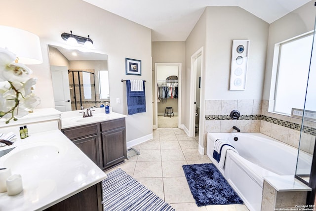 bathroom featuring vanity, separate shower and tub, and tile patterned floors