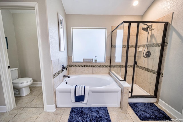 bathroom with tile patterned flooring, shower with separate bathtub, and toilet