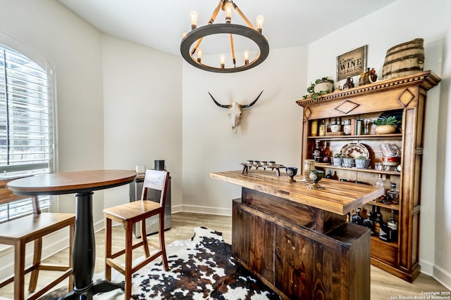 dining area featuring a chandelier and light hardwood / wood-style floors