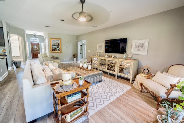 living room with hardwood / wood-style floors and ceiling fan