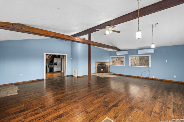 unfurnished living room featuring dark hardwood / wood-style floors, lofted ceiling with beams, and an AC wall unit