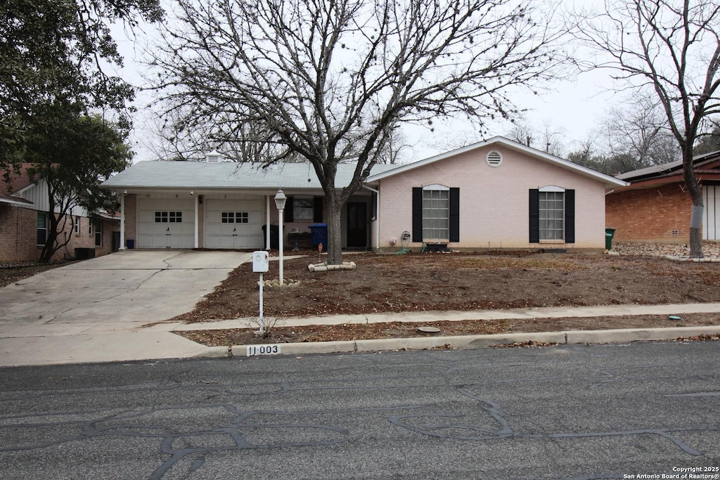 ranch-style house featuring a garage