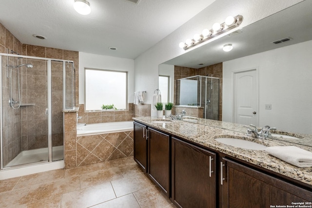 bathroom featuring tile patterned floors, vanity, and independent shower and bath