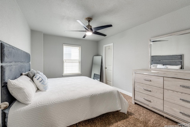 carpeted bedroom with a textured ceiling and ceiling fan