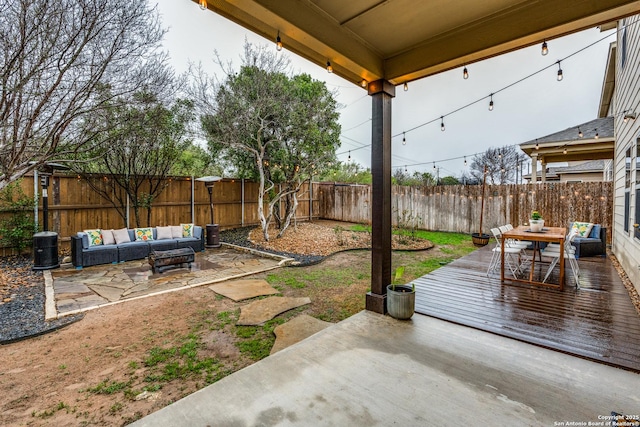 view of patio with outdoor lounge area and a deck