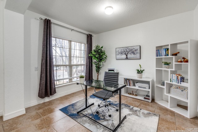 home office featuring a textured ceiling