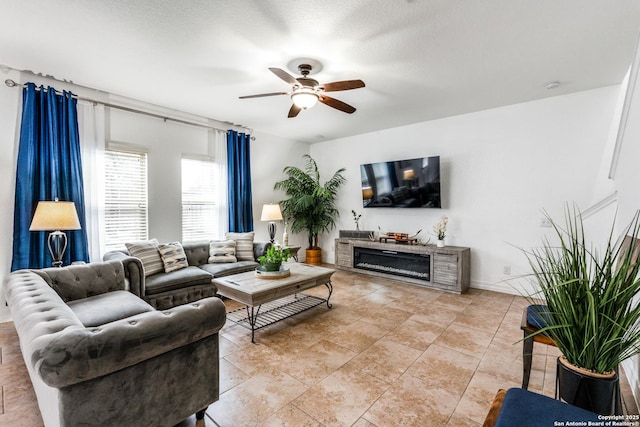 living room featuring light tile patterned floors and ceiling fan