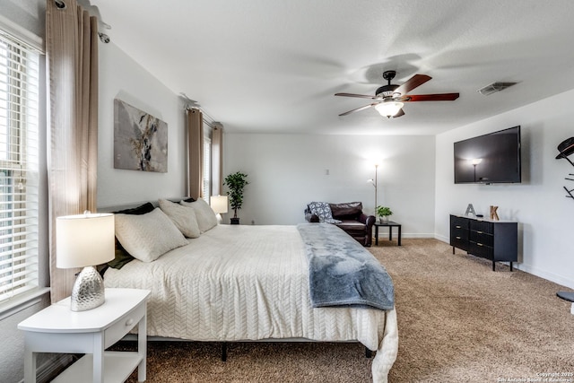 bedroom featuring ceiling fan and carpet floors