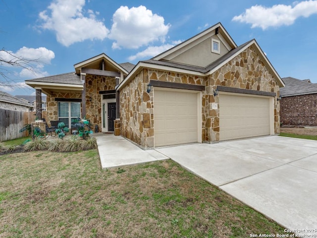 view of front of home with a garage and a front lawn