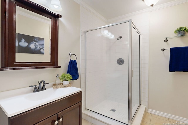 bathroom featuring tile patterned flooring, vanity, crown molding, and a shower with door