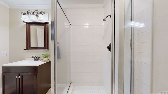 bathroom with vanity, an enclosed shower, and ornamental molding