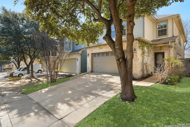 view of front facade with a garage, stone siding, concrete driveway, and a front yard