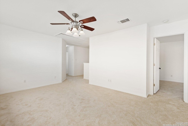 unfurnished room featuring carpet floors, ceiling fan, and visible vents