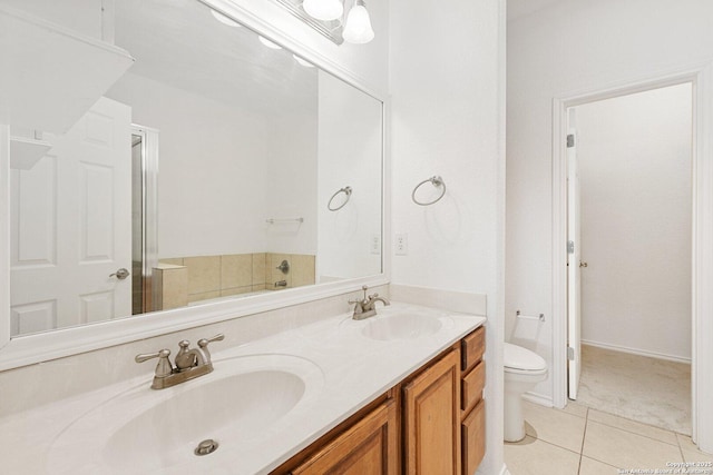 full bathroom featuring tile patterned flooring, a sink, toilet, and double vanity