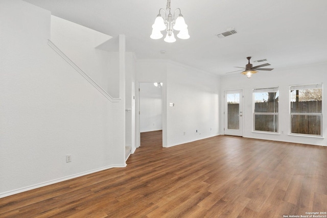 unfurnished living room featuring visible vents, plenty of natural light, baseboards, and wood finished floors