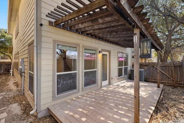 deck with central AC, fence, and a pergola