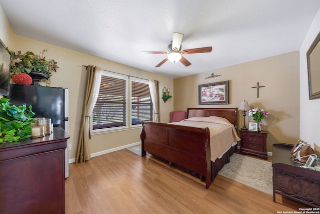 bedroom featuring ceiling fan and light wood-type flooring