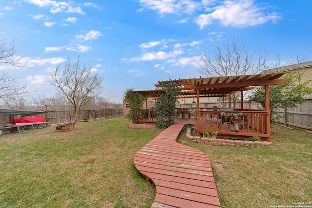 view of yard with a wooden deck and a pergola