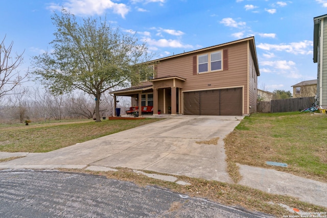 view of front of house with a garage, a front yard, and covered porch